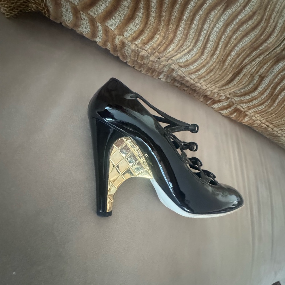 Glossy Black Lace-Up Heels with Gold Accent